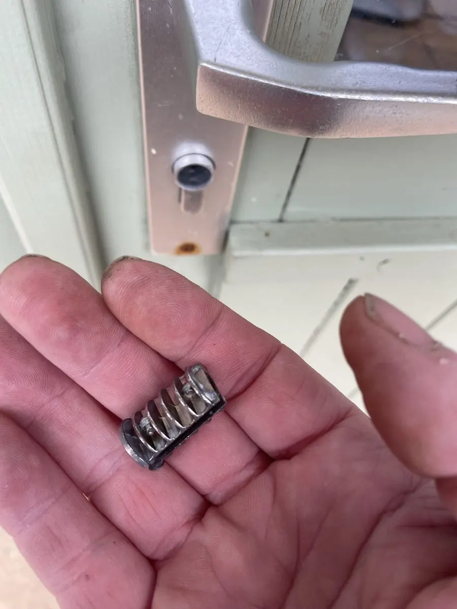 Broken lock plug being removed by Keywise locksmith Southampton without damaging the door