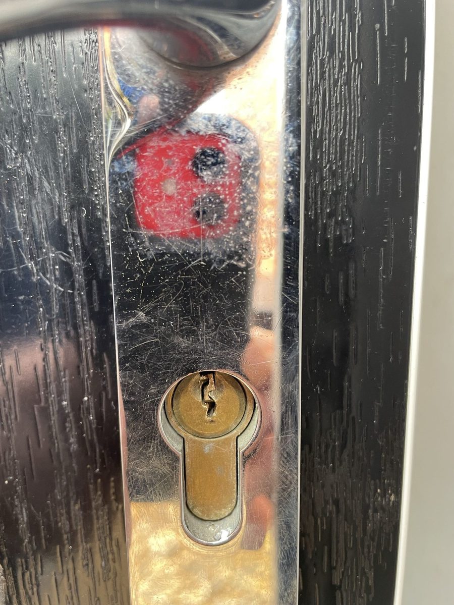 A snapped key with half the blade still stuck inside the lock barrel