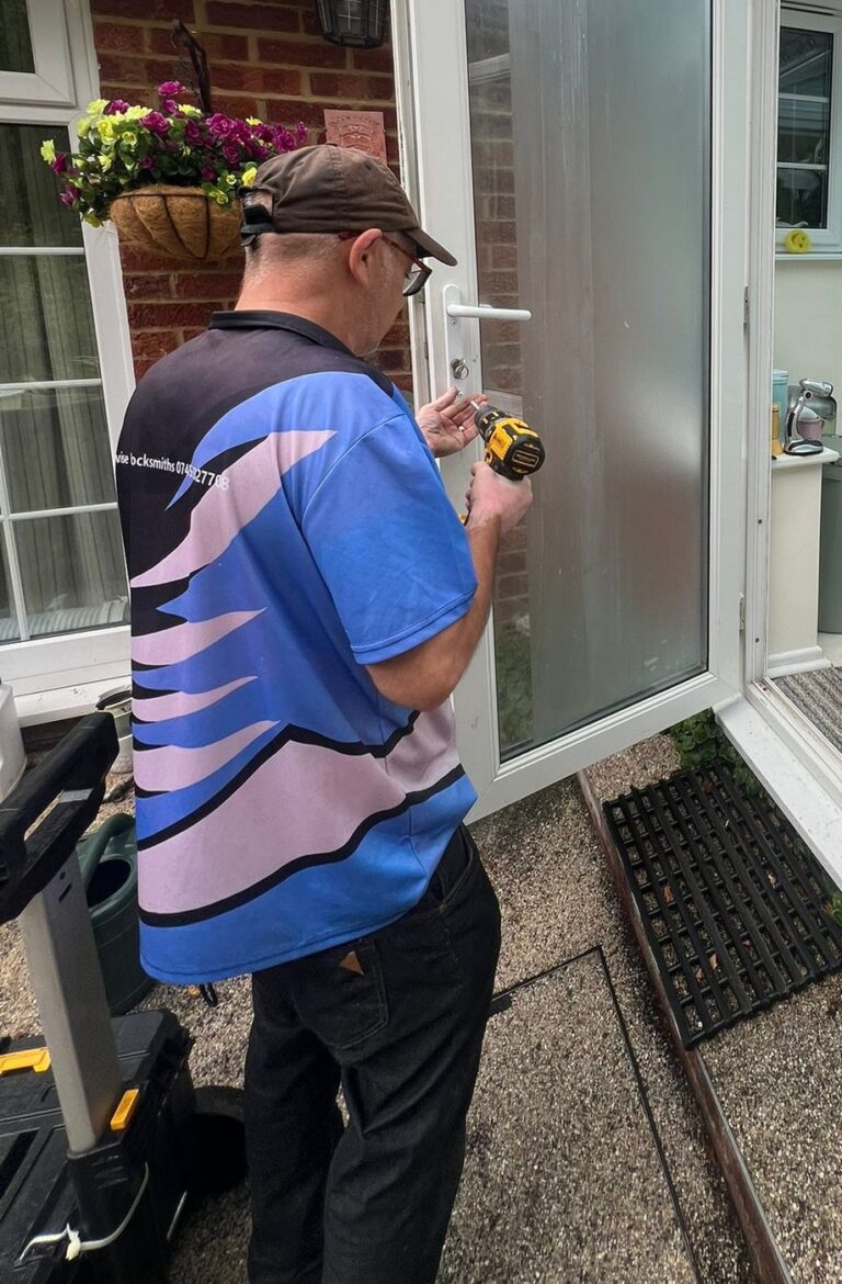 Taking the handles off the jammed uPVC conservatory door with a cordless driver