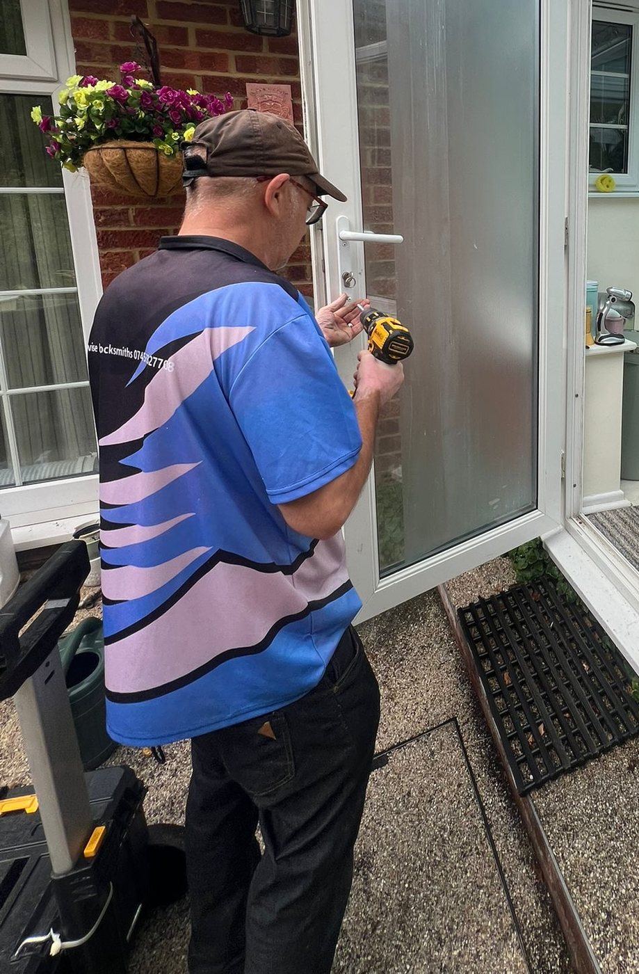 Taking the handles off the jammed uPVC conservatory door with a cordless driver