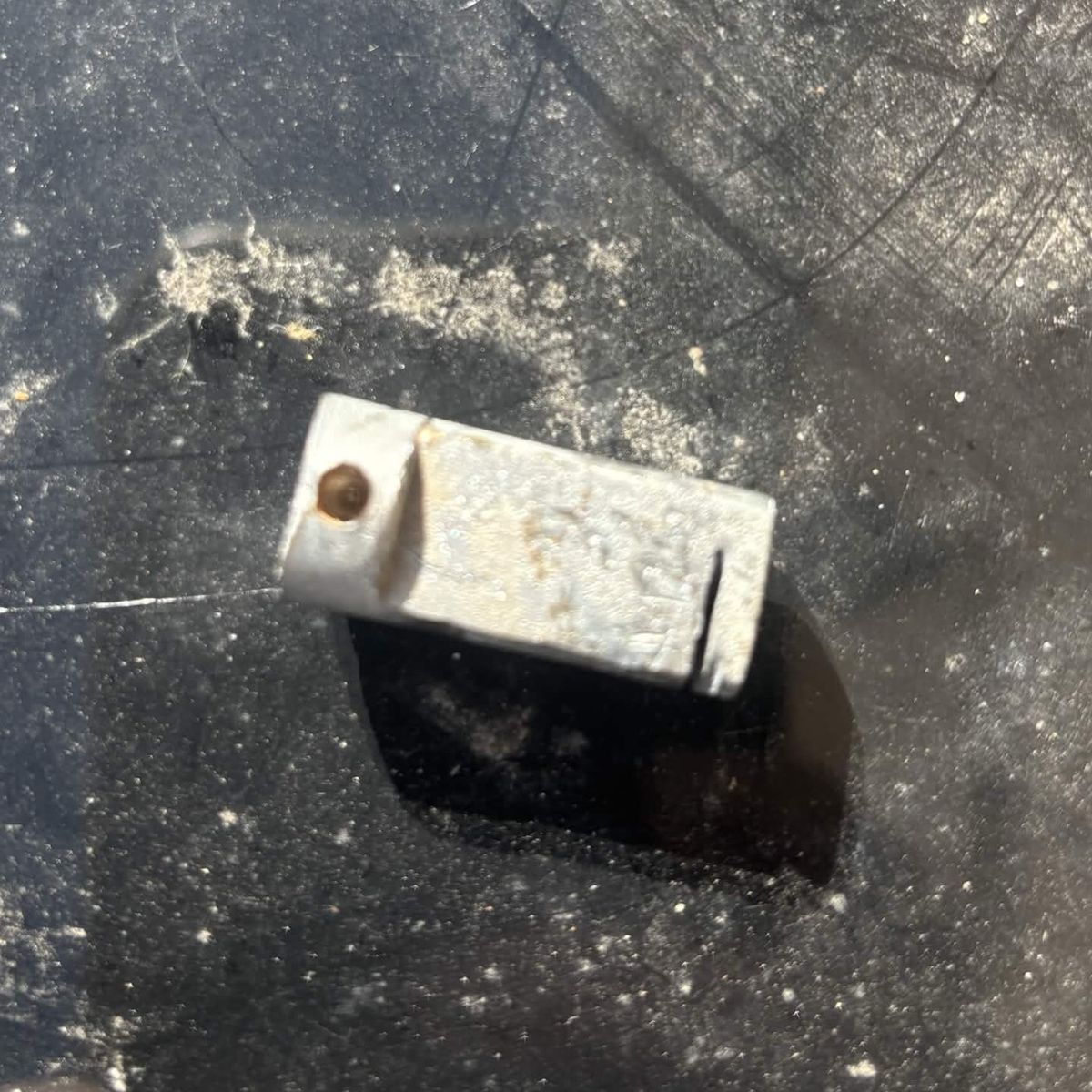 Worn shoot bolt pulled out of a timber door after it failed