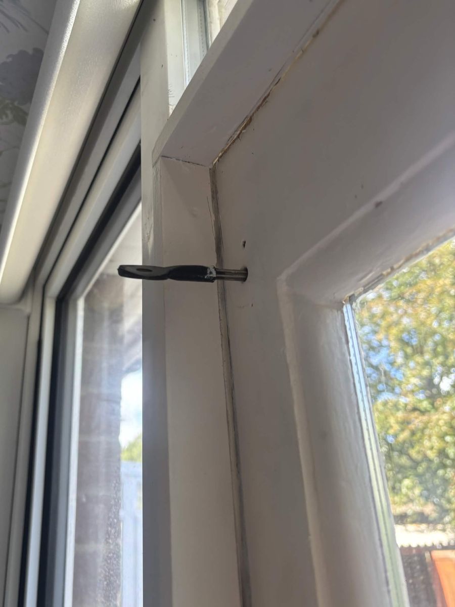 Failed shoot bolt at the top of a timber garden door