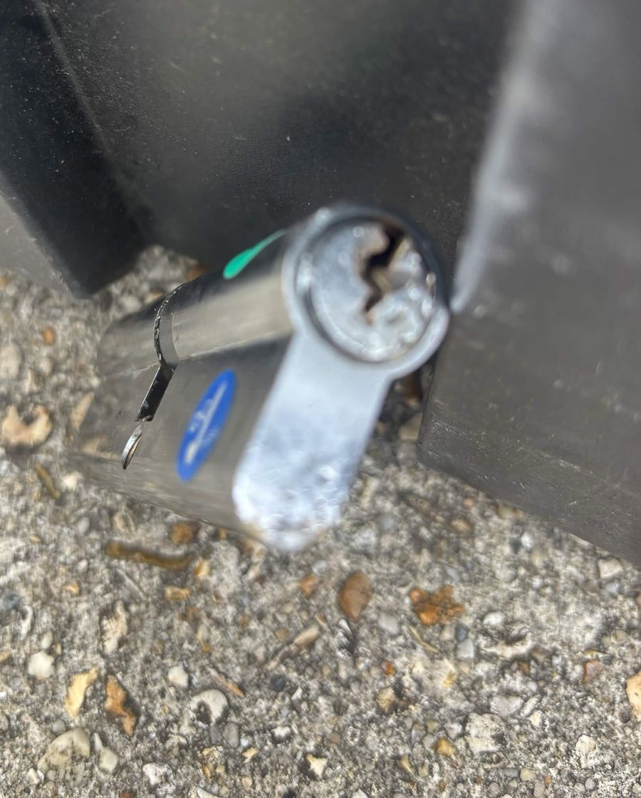 Euro cylinder taken out of a door with the snapped key still lodged deep inside the keyway